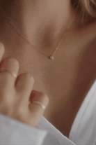 A close-up video of the Lumé Necklace by Bluebird Jewellery, inspired by the French word for ‘light,’ crafted as a radiant symbol of warmth and kindness.