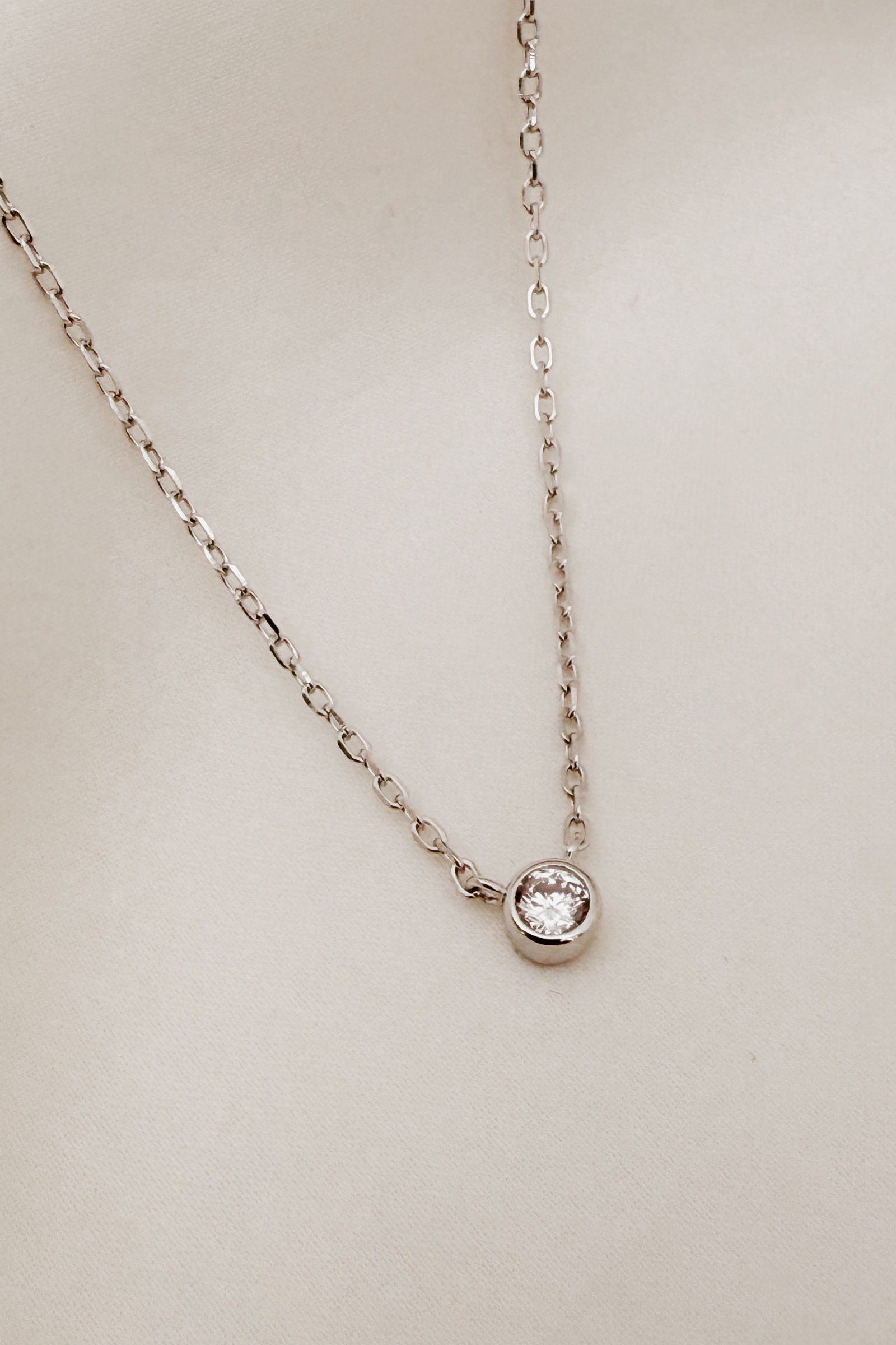 A delicate silver Lumé Necklace by Bluebird Jewellery, designed as a radiant keepsake symbolising light, love, and personal strength.