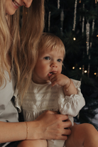 Matching Darling Posie bracelets worn by a mum and her daughter