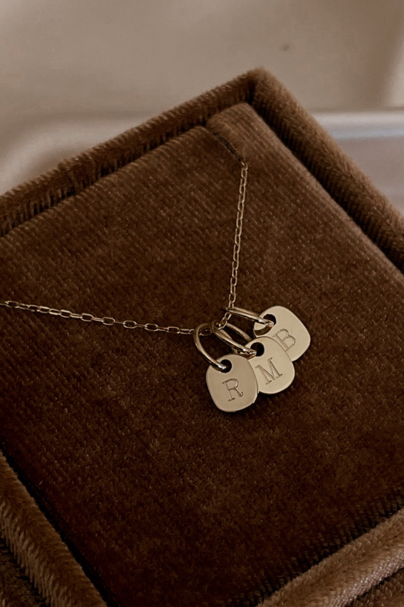 The Mini Rectangular Pendants by Bluebird Jewellery features gentle curves and a luxe, modern silhouette. Personalised with your chosen letter, it embodies feminine elegance and can be worn beautifully on any necklace, bracelet, or anklet chain.