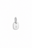 A sterling silver mini rectangular pendant with pre-cast letter R on it

