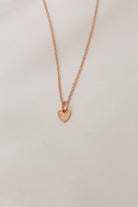 Rose Gold Petite Darling Necklace with an organic shaped petite heart pendant on a fine cable chain necklace.