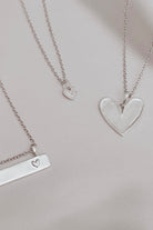 A Darling Bar Necklace, Petite Darling Necklace and Darling Necklace are all shown alongside one another.