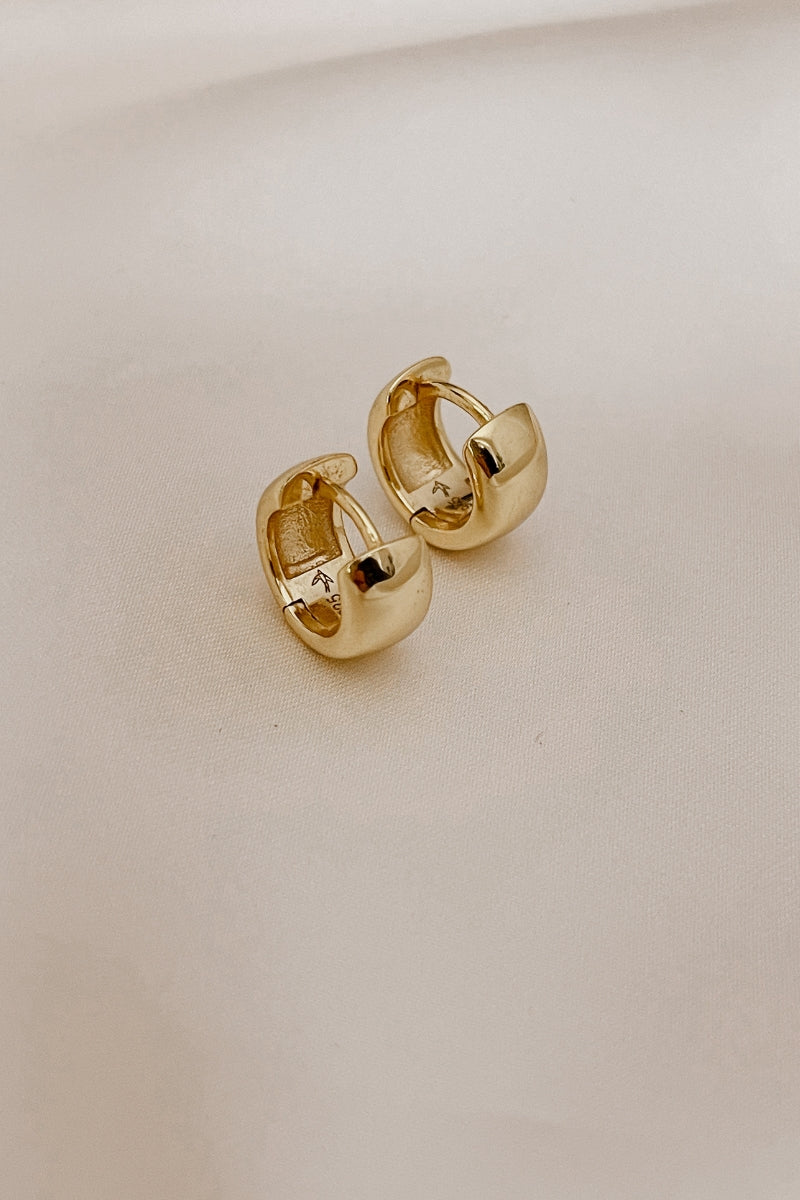 Petite Huggie earrings - gold plated with Bluebird Jewellery logo engraved inside of the earring.