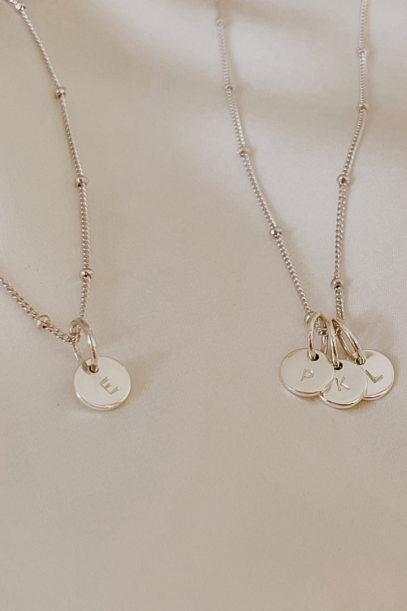 Personalised Initial pendants on a ball chain necklace in matching mum and child necklace lengths.