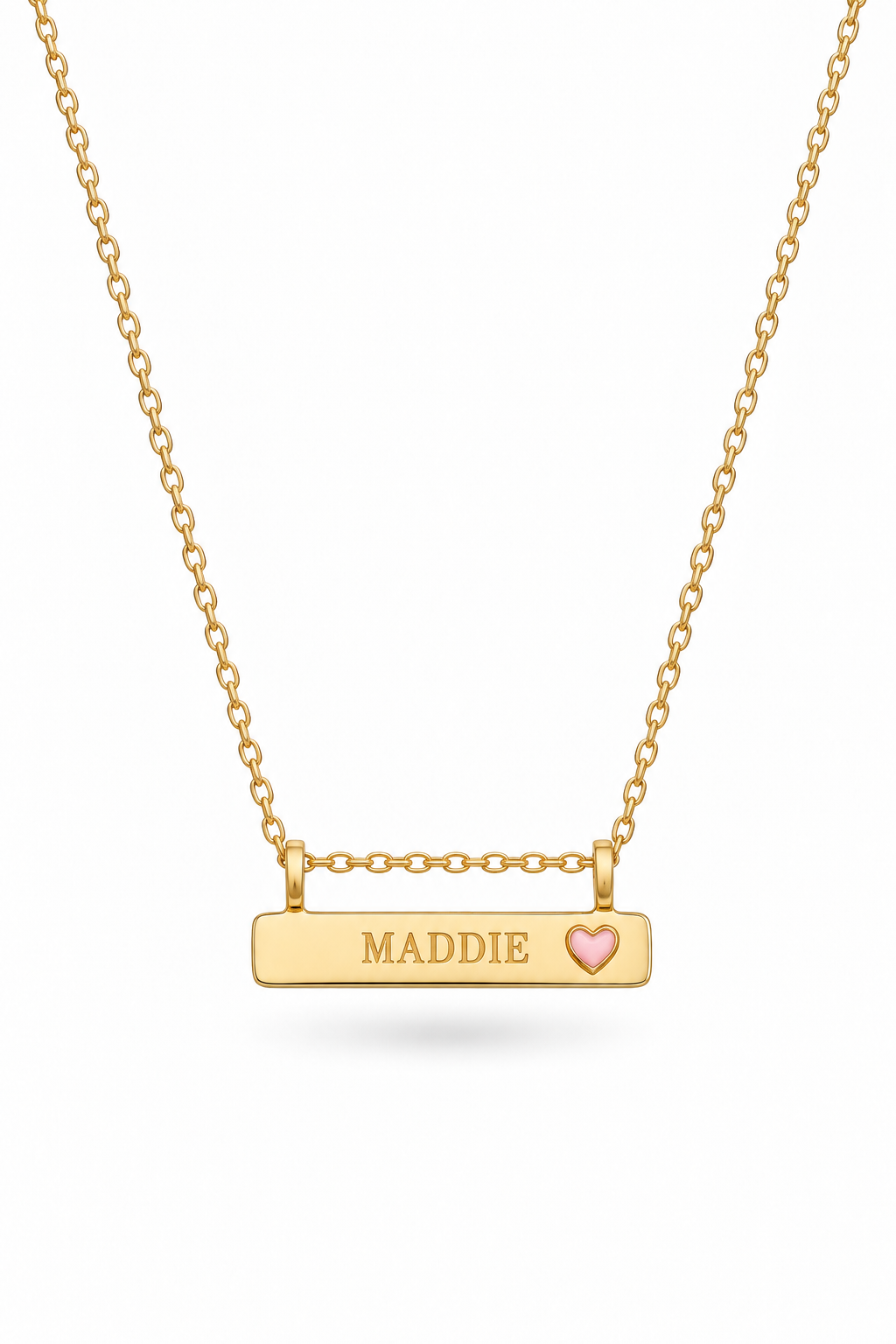 A Bluebird gold bar necklace with a rectangular pendant engraved with the name 'MADDIE' and a small pink heart, suspended from a delicate gold chain on a white background.