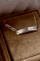 Bluebird Co engraved Pink Darling bracelet in silver, packaged in velvet box. 