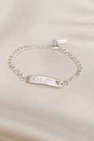 A Pink Darling Bracelet is personalised with engraving of a name on the front of the bracelet.