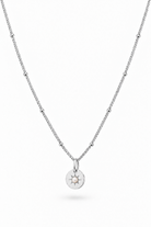 A delicate sterling silver chain necklace with small pearl accents and a circular sunburst pendant, shown on a clean white background.