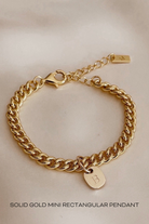 A detailed image of a gold Cuban Link Chain featuring a minimalist soild gold rectangular pendant, crafted in elegant fine jewellery style.