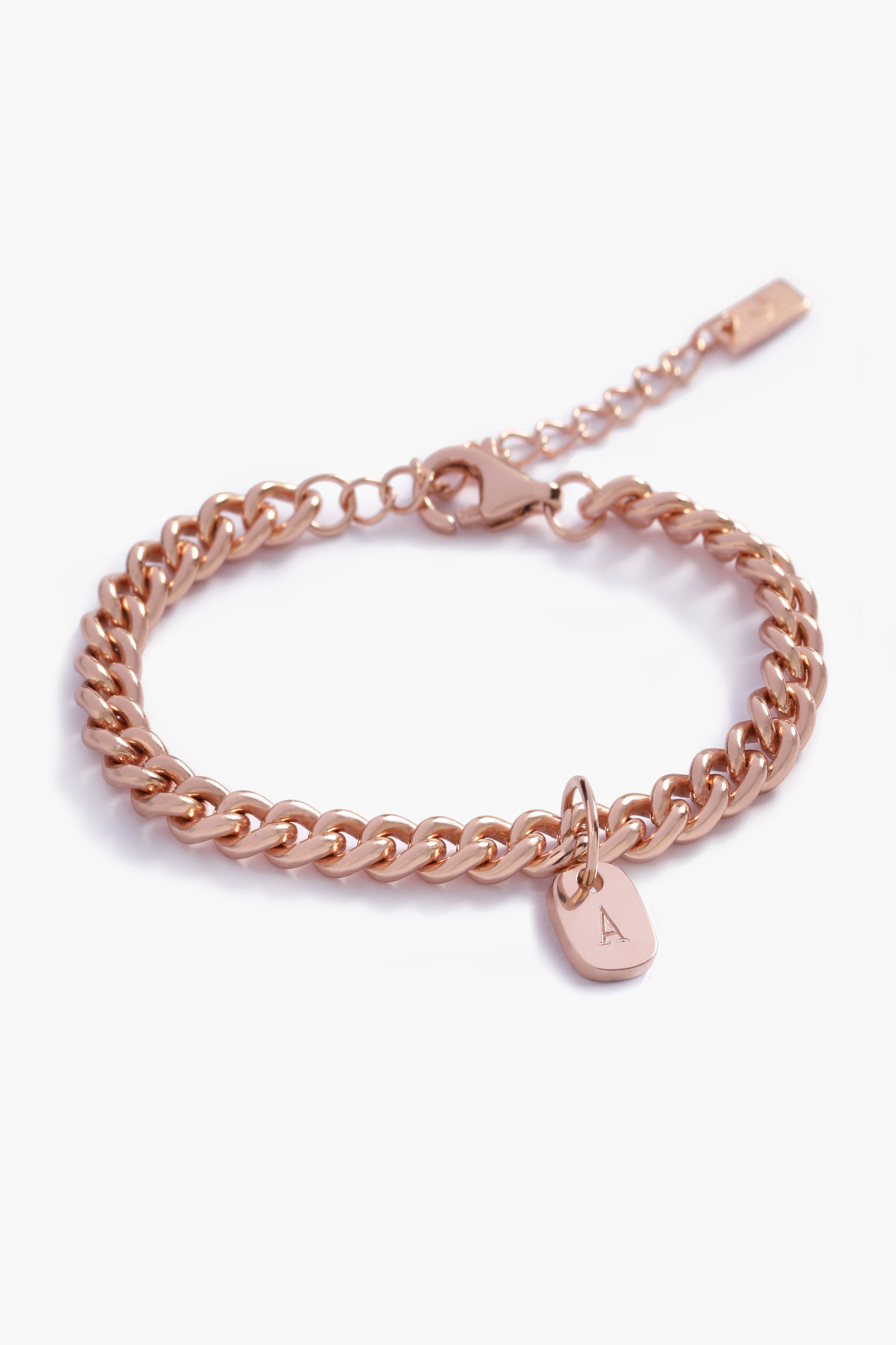 A detailed image of a rose gold Cuban Link Chain featuring a minimalist soild gold rectangular pendant, crafted in elegant fine jewellery style by Bluebird Co