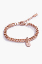 A detailed image of a rose gold Cuban Link Chain featuring a minimalist soild gold rectangular pendant, crafted in elegant fine jewellery style.