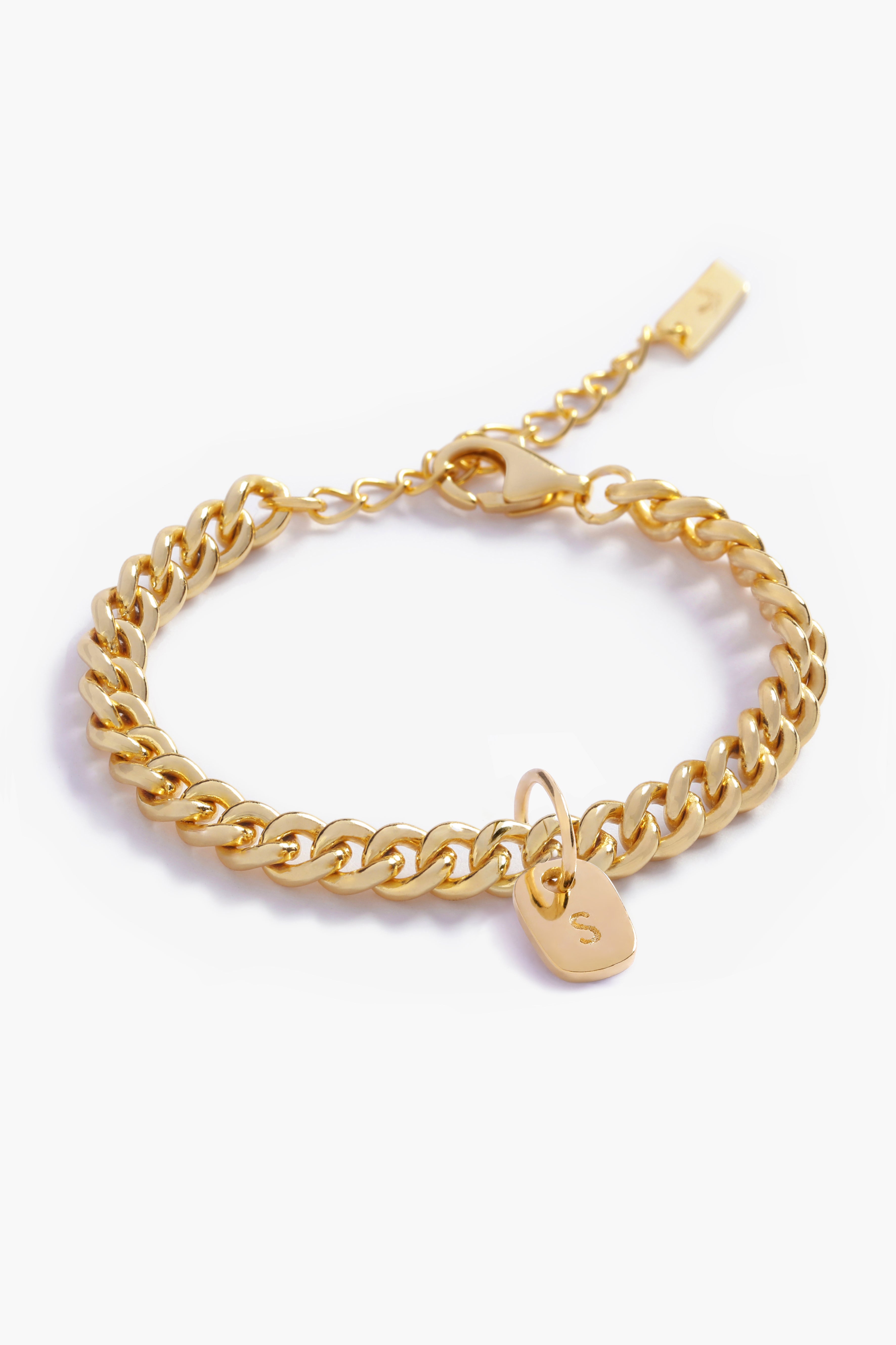 A detailed image of a gold Cuban Link Chain featuring a minimalist rectangular pendant, crafted in elegant fine jewellery style by Bluebird Jewellery.