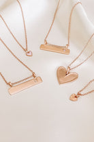 Rose Gold Darling Necklaces all on silk.  Engravable Bar pendants as well as personalised heart pendant necklaces on fine cable chain necklaces.