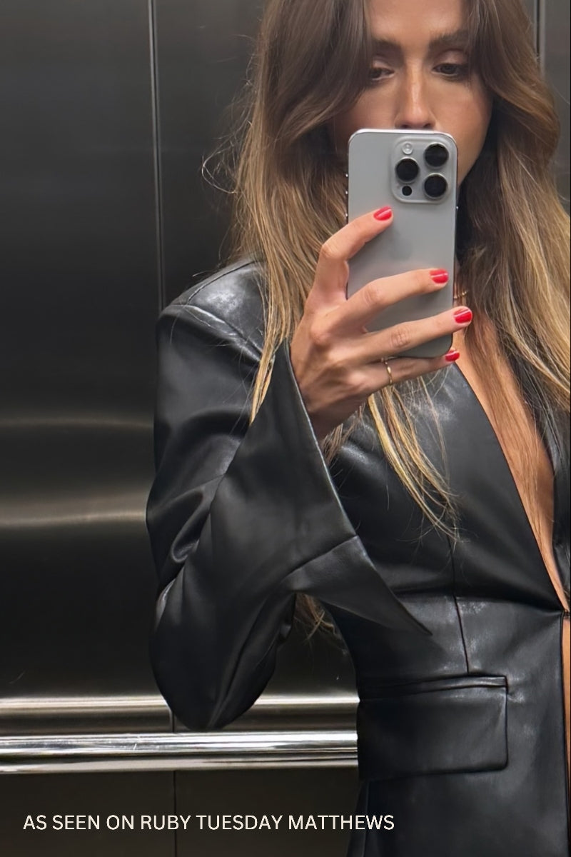 Ruby Tuesday Matthews wears the Signature Pinky Ring in size 4 with a leather jacket.