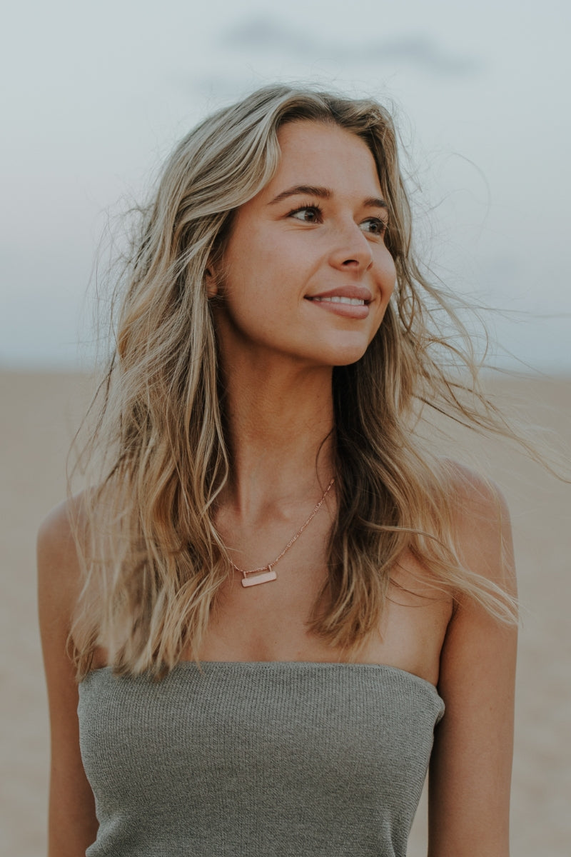 Personalised Signature Bar Necklace in rose gold worn by model. Stylish gift for women with timeless meaning.