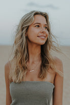 Personalised Signature Bar Necklace in rose gold worn by model. Stylish gift for women with timeless meaning.