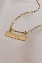 The word Bambi is engraved on the front of a Signature Bar Necklace and looks both timeless and meaningful.