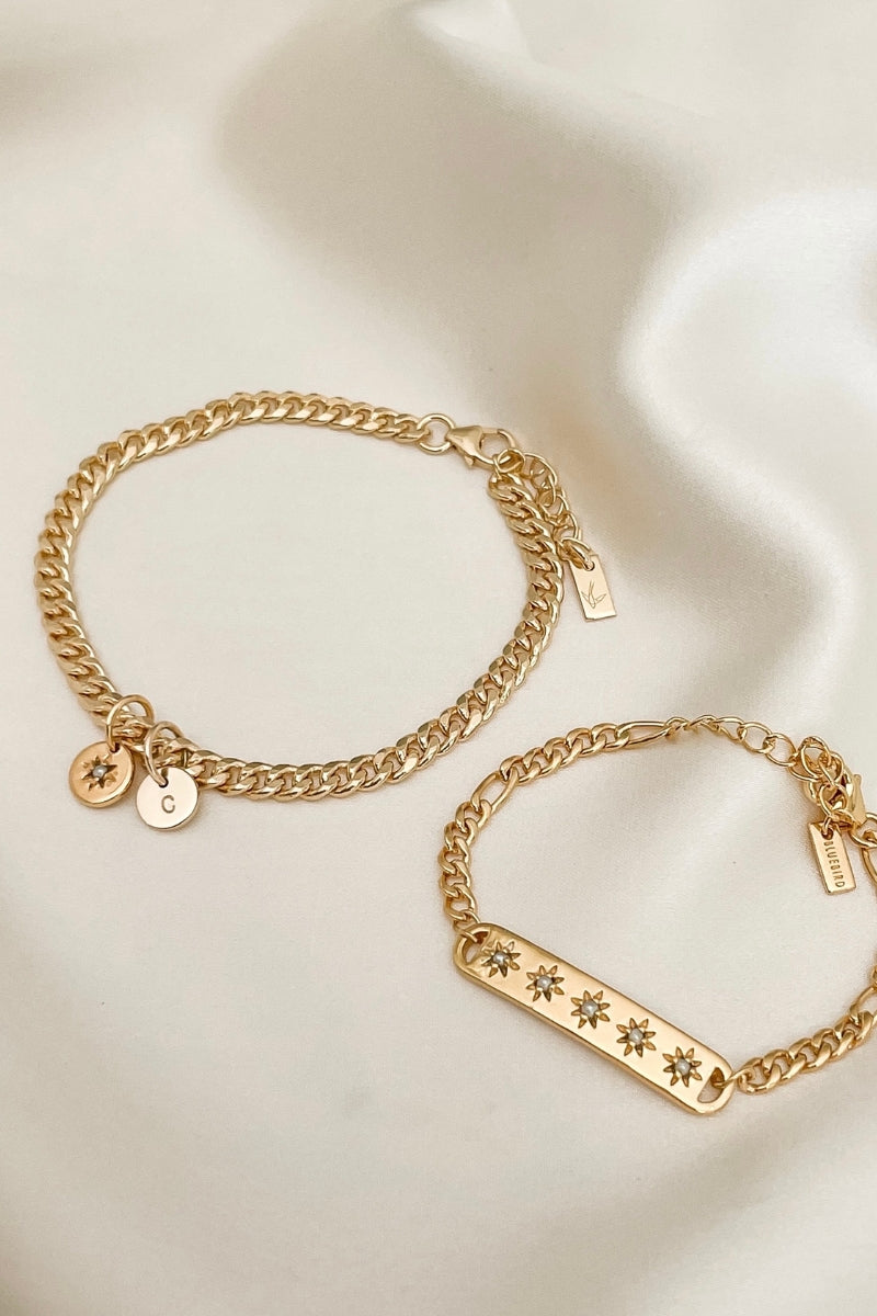 A close-up of a Cuban Link Chain with a single vintage pearl pendant and vintage pearl bracelet, designed as a refined keepsake set by Bluebird Jewellery.