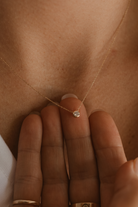 A close-up of the Lumé Necklace by Bluebird Jewellery, inspired by the French word for ‘light,’ crafted as a radiant symbol of warmth and kindness.