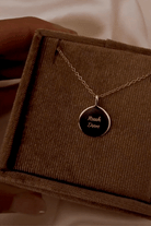 Blue Bird's Soleil Pednant on a velvet jewellery box. 