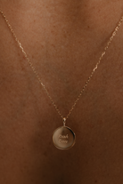 A close-up image of the Soléil Pendant – 9ct Gold with chain, featuring a radiant round design and complimentary engraving on both sides for a truly personal touch.