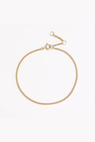 A close-up of the Solid Gold Bracelet by Bluebird Jewellery, crafted in fine gold as a personalised piece for both casual and refined occasions.