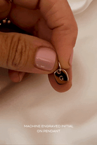 Bluebird Co's solid gold rectangular initial pendant, with engravement 