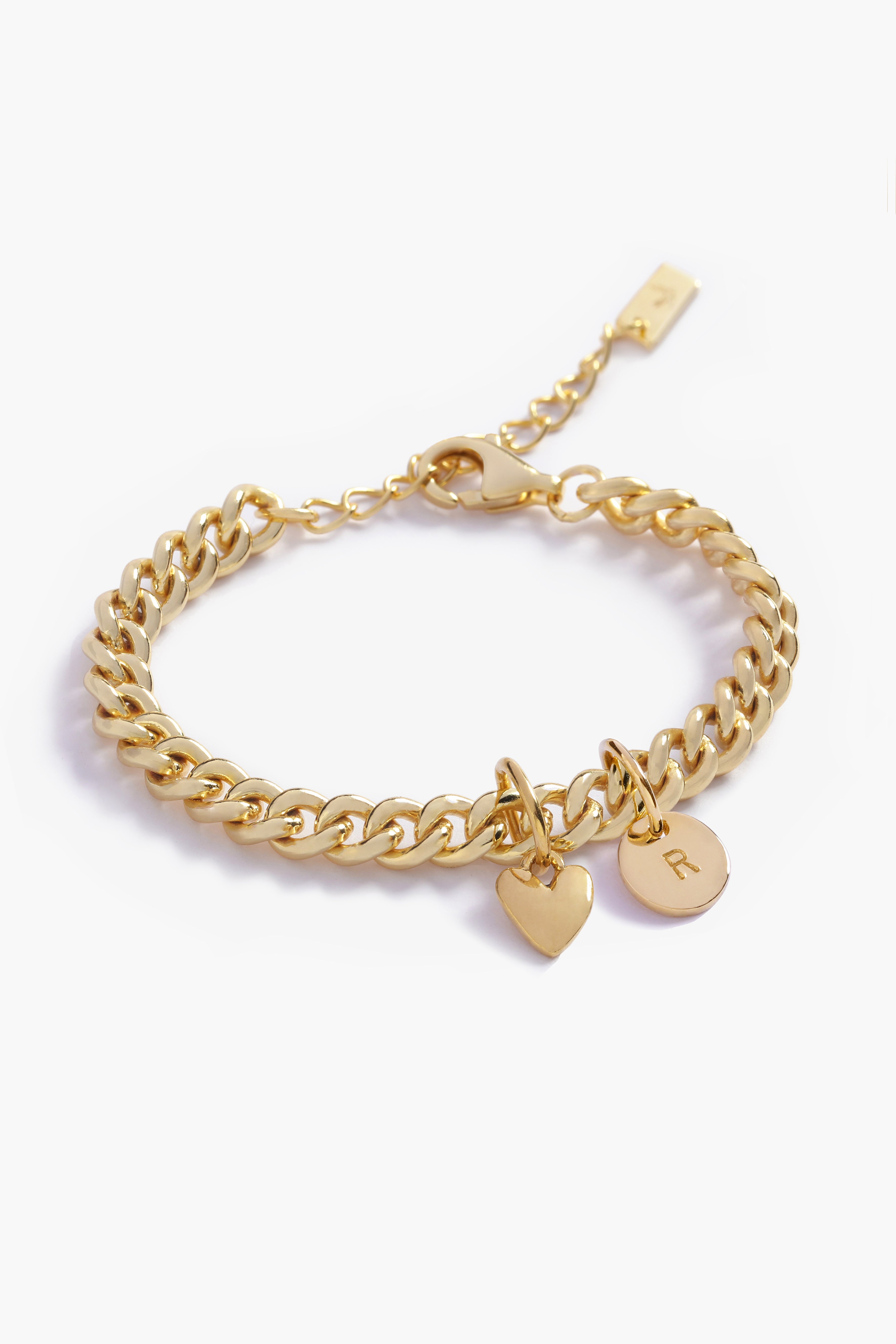 A Sweetheart Cuban Link Chain Anklet featuring a polished heart charm and personalised soild gold initial pendant, crafted as a meaningful fine jewellery piece.