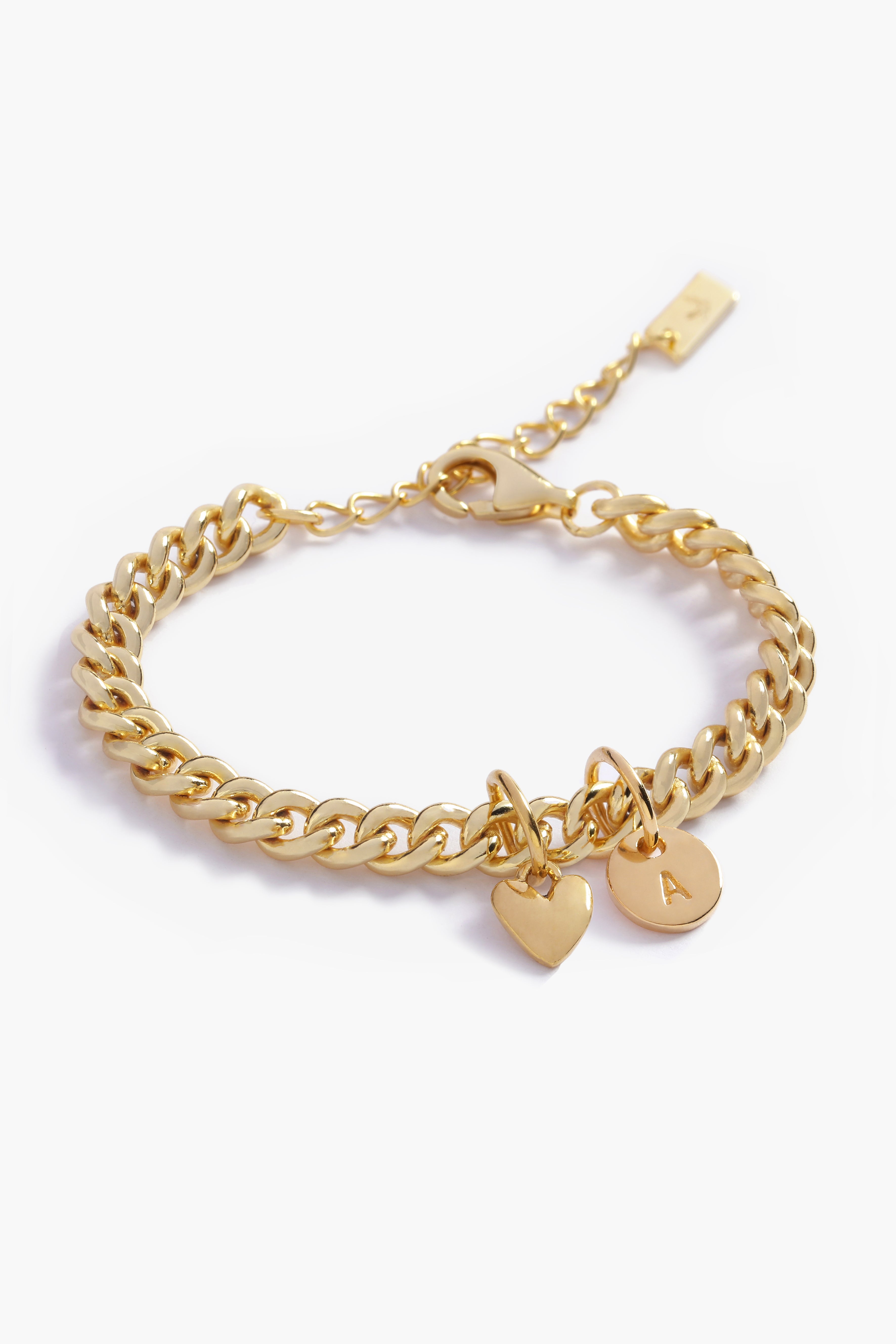 A Sweetheart Cuban Link Chain Bracelet featuring a polished heart charm and personalised gold initial pendant, crafted as a meaningful fine jewellery piece.