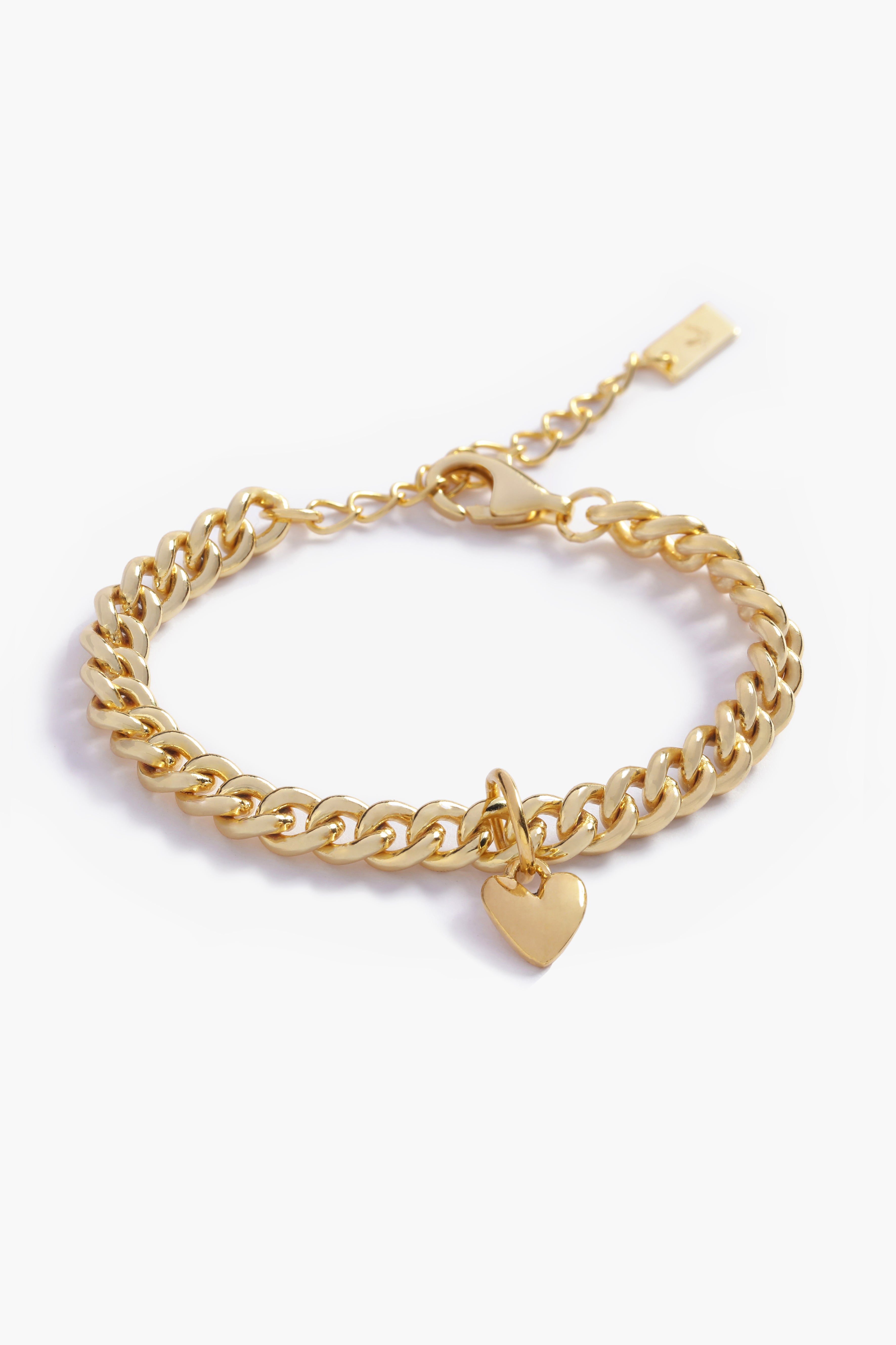 A gold Sweetheart Cuban Link Chain Bracelet featuring a polished heart charm, crafted as a modern and elegant fine jewellery piece.