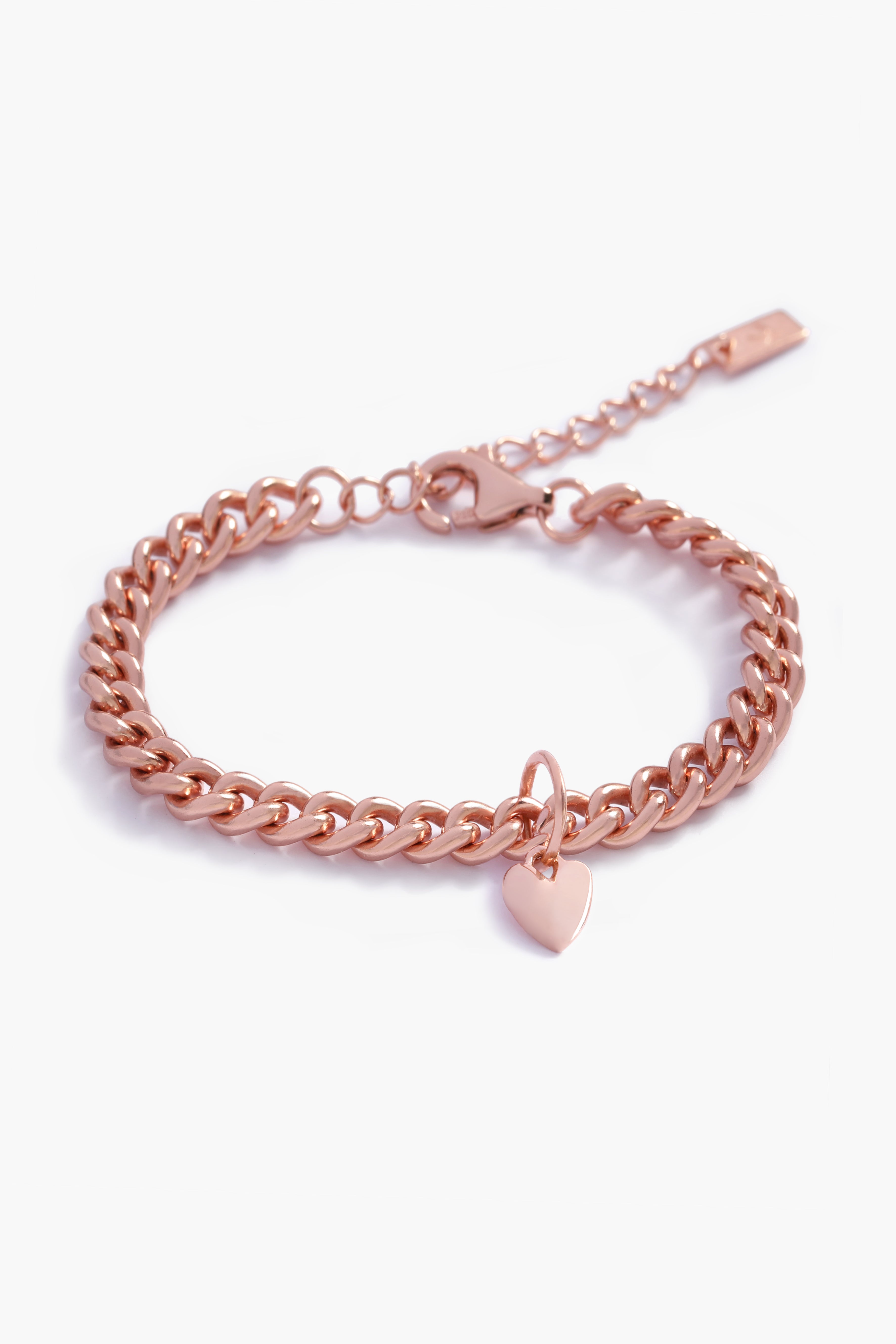 A rose gold Sweetheart Cuban Link Chain Bracelet featuring a polished heart charm, crafted as a modern and elegant fine jewellery piece by Bluebird Co