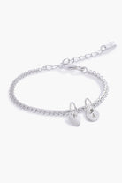 A detailed image of the Sweetheart Lace Chain Bracelet with a heart charm and initial pendant, designed as an elegant piece of fine personalised jewellery.