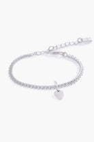 A detailed image of the silver Sweetheart Lace Chain Bracelet with a heart charm, designed with lace-inspired links for a delicate finish.