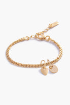 A personalised Lace Chain Bracelet featuring a heart charm and soild gold mini rectangular initial pendant, designed as an elegant fine jewellery gift for all ages.