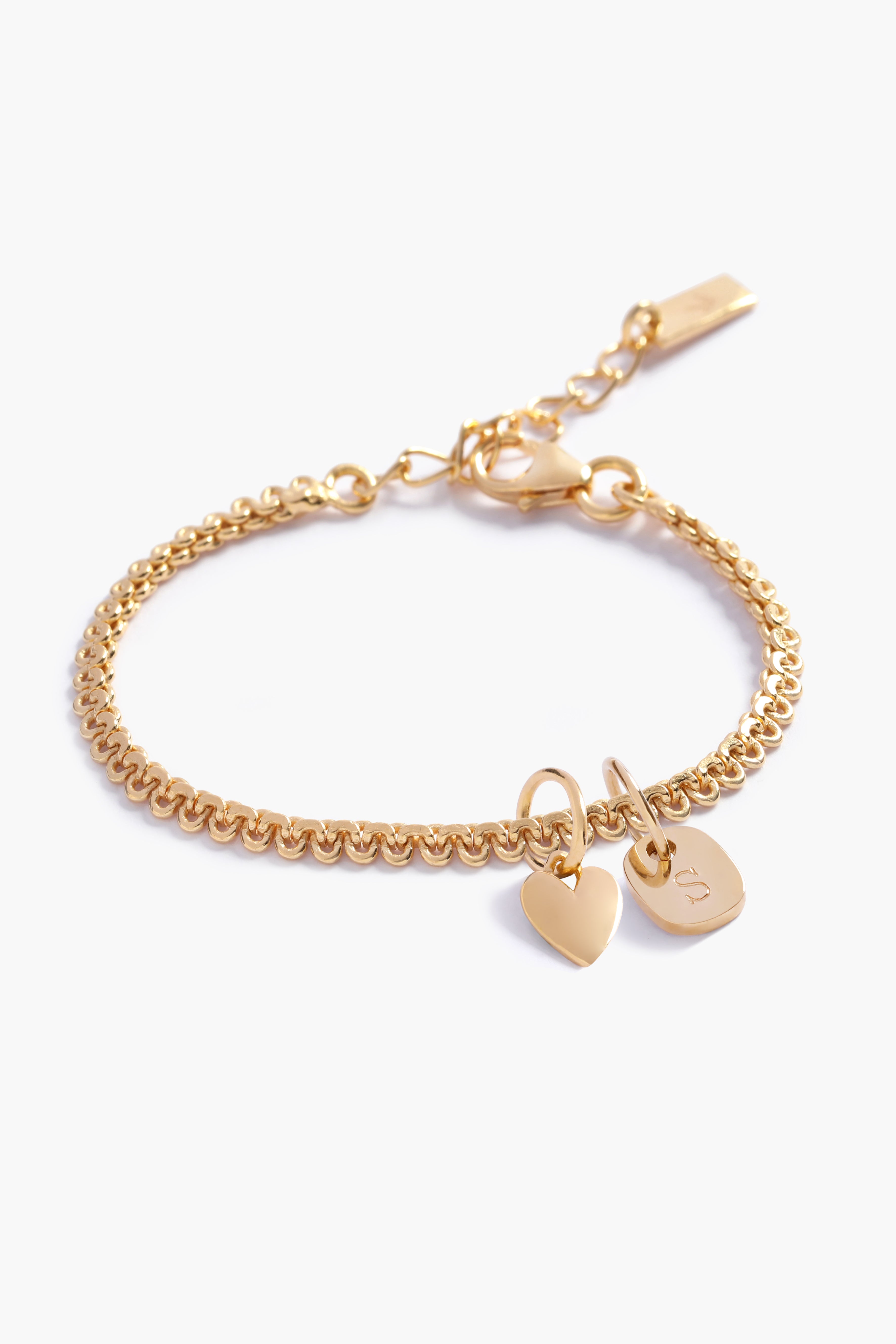 A personalised Lace Chain Bracelet featuring a heart charm and soild gold mini rectangular initial pendant, designed as an elegant fine jewellery gift for all ages.