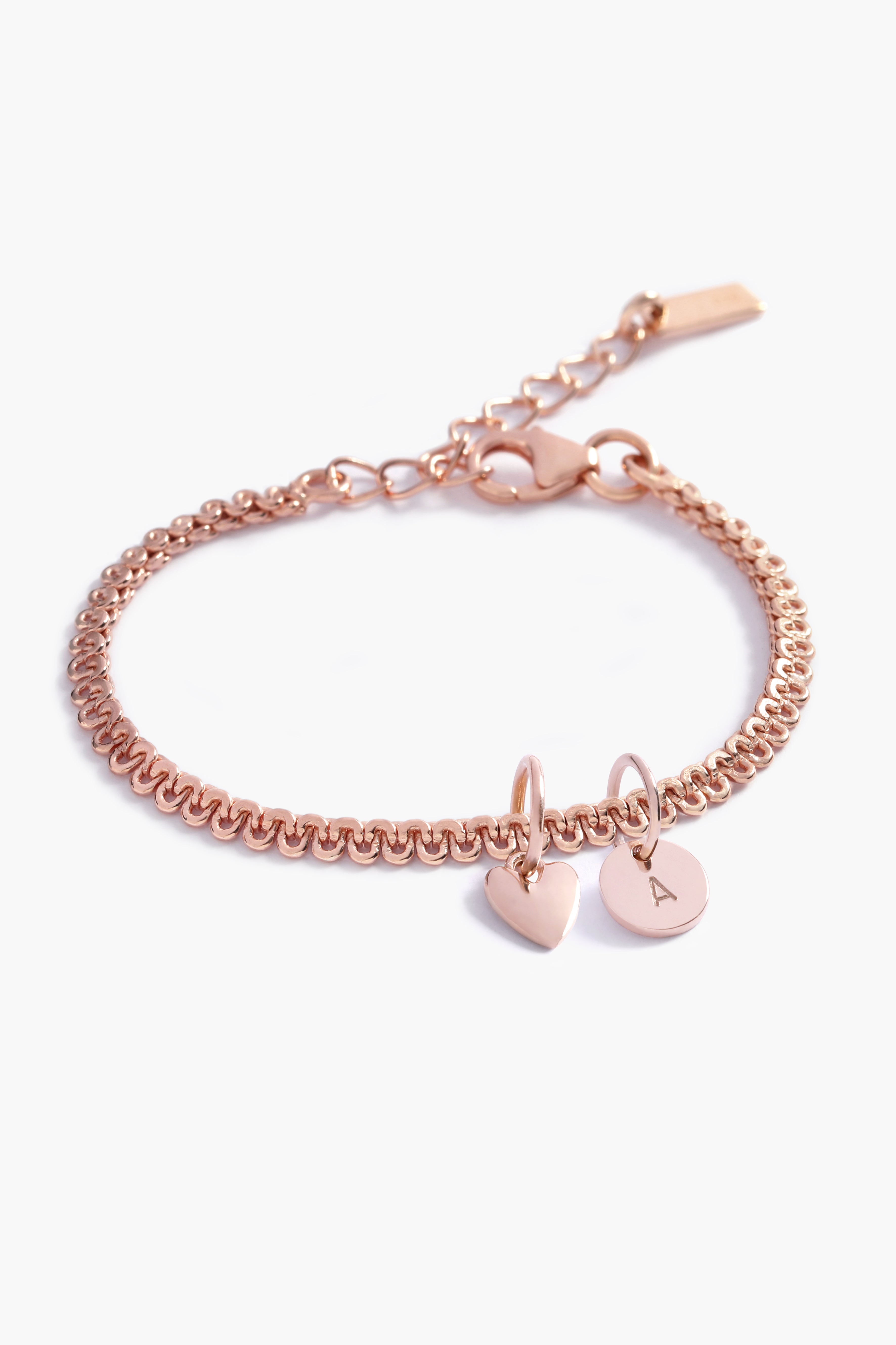 A delicate Lace Chain Bracelet with a heart charm and engraved initial pendant, designed as timeless personalised jewellery by Bluebird Co