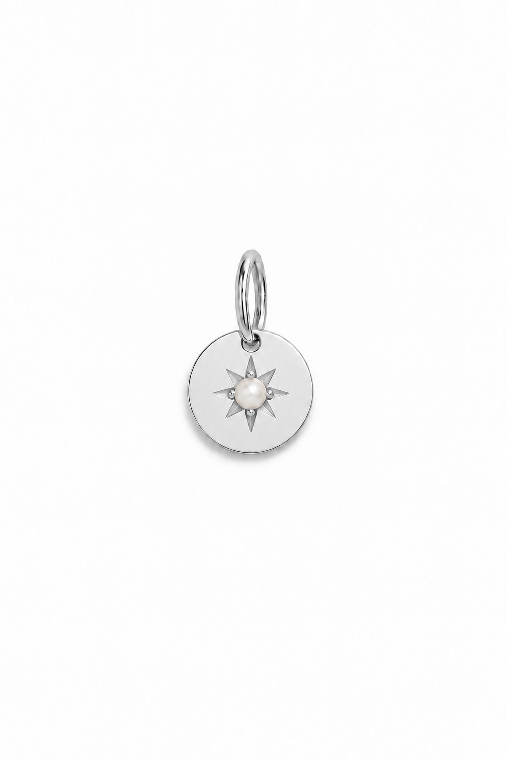 A silver vintage inspired pendant with seed pearl at its centre.