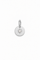 A silver vintage inspired pendant with seed pearl at its centre.