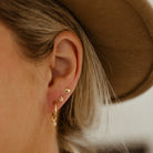 Petite Daisy Stud is worn with a Petite Diasy Hoop Earring and Petite Shell Stud