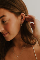 Darling Drop Sterling Silver Earrings layered with studs for a soft, everyday personalised look.