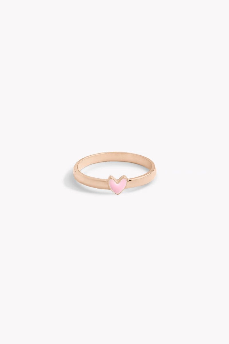 Rose gold ring with pink heart-shaped charm shown front on.