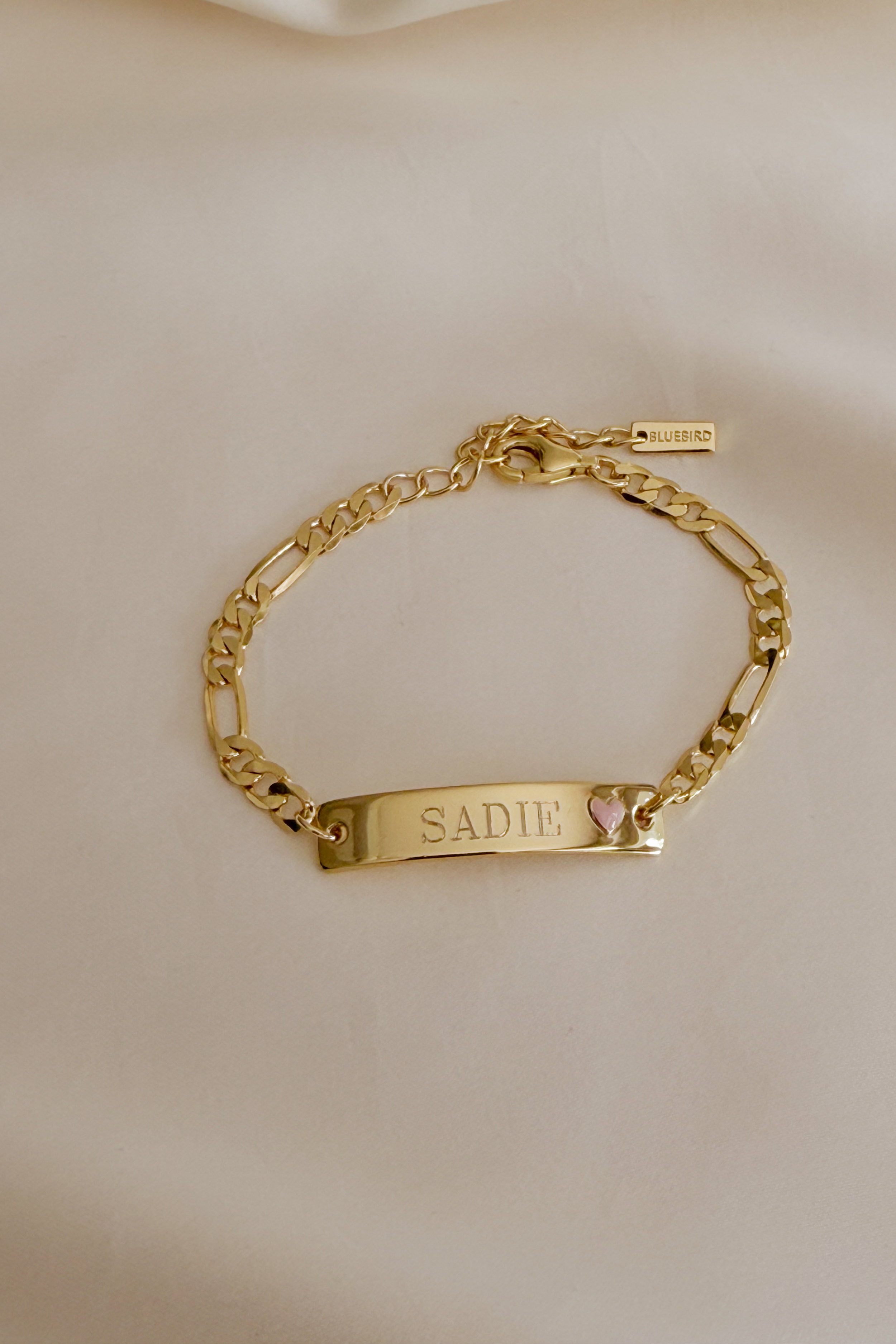 Engraved Pink Darling Gold bracelet with pink heart—personalised jewellery for babies, children, or meaningful gifting by Bluebird Jewellery.