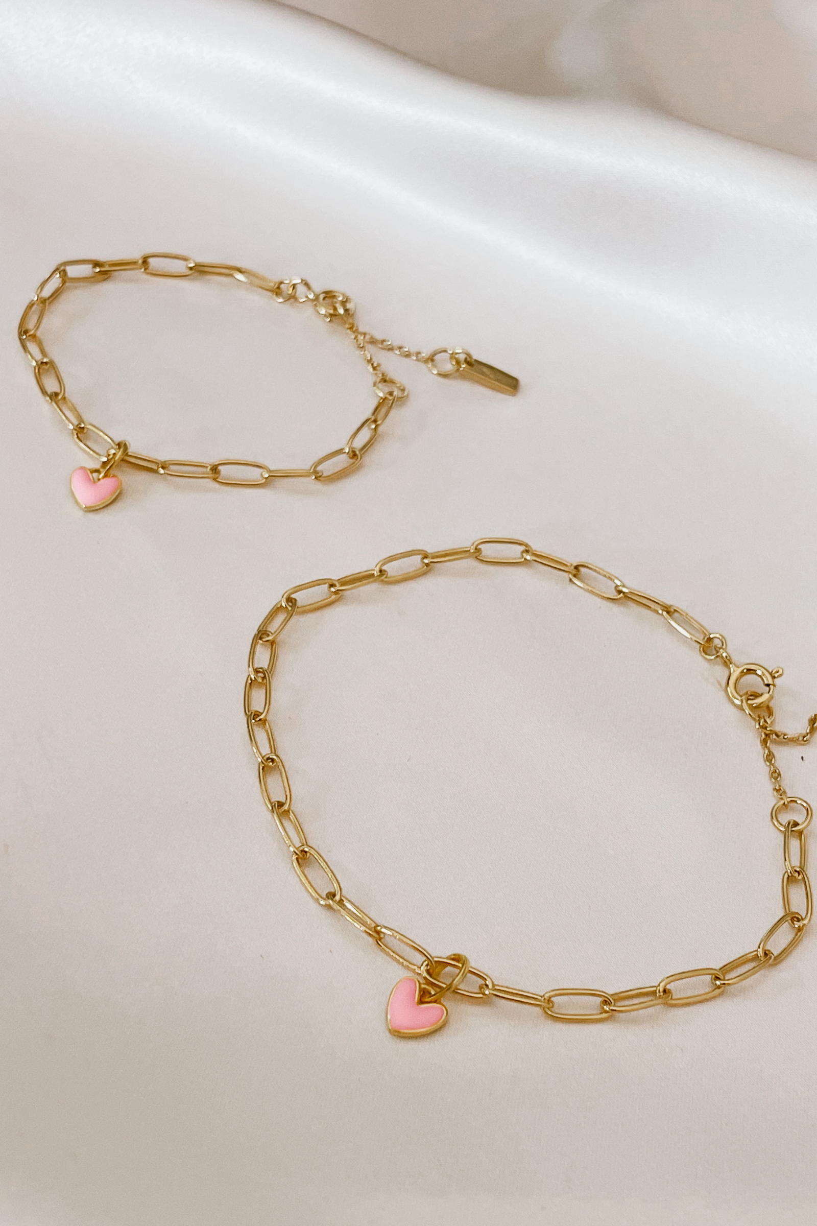 Matching Darling Posie Bracelets Gold with pink heart charms, designed for babies, children, and adults by Bluebird Jewellery