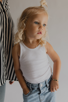 Toddler wearing Pink Darling Gold engraved bracelet and necklace—personalised jewellery gift for daughters or nieces.