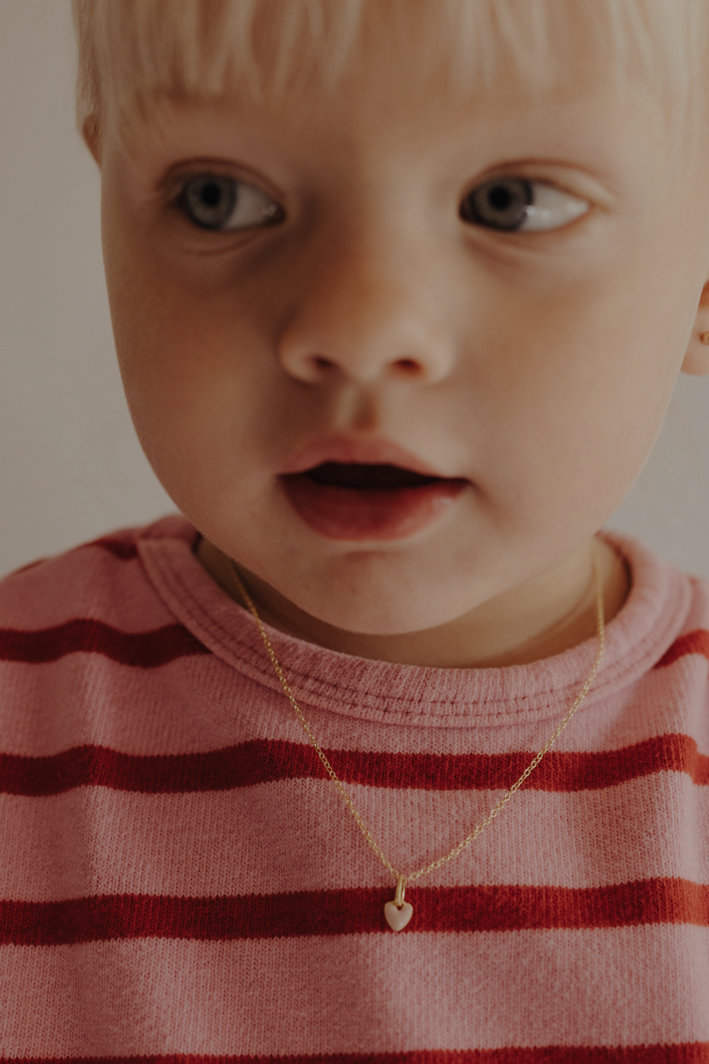 Toddler wearing pink petite Darling Necklace Gold 