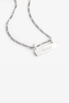 Signature Bar Necklace Silver engraved with “FRANKIE” displayed on a clean white background. A minimal and elegant silver name necklace.