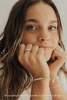 Teen girl wearing engraved signature bracelet silver and ring set, styled as everyday jewellery