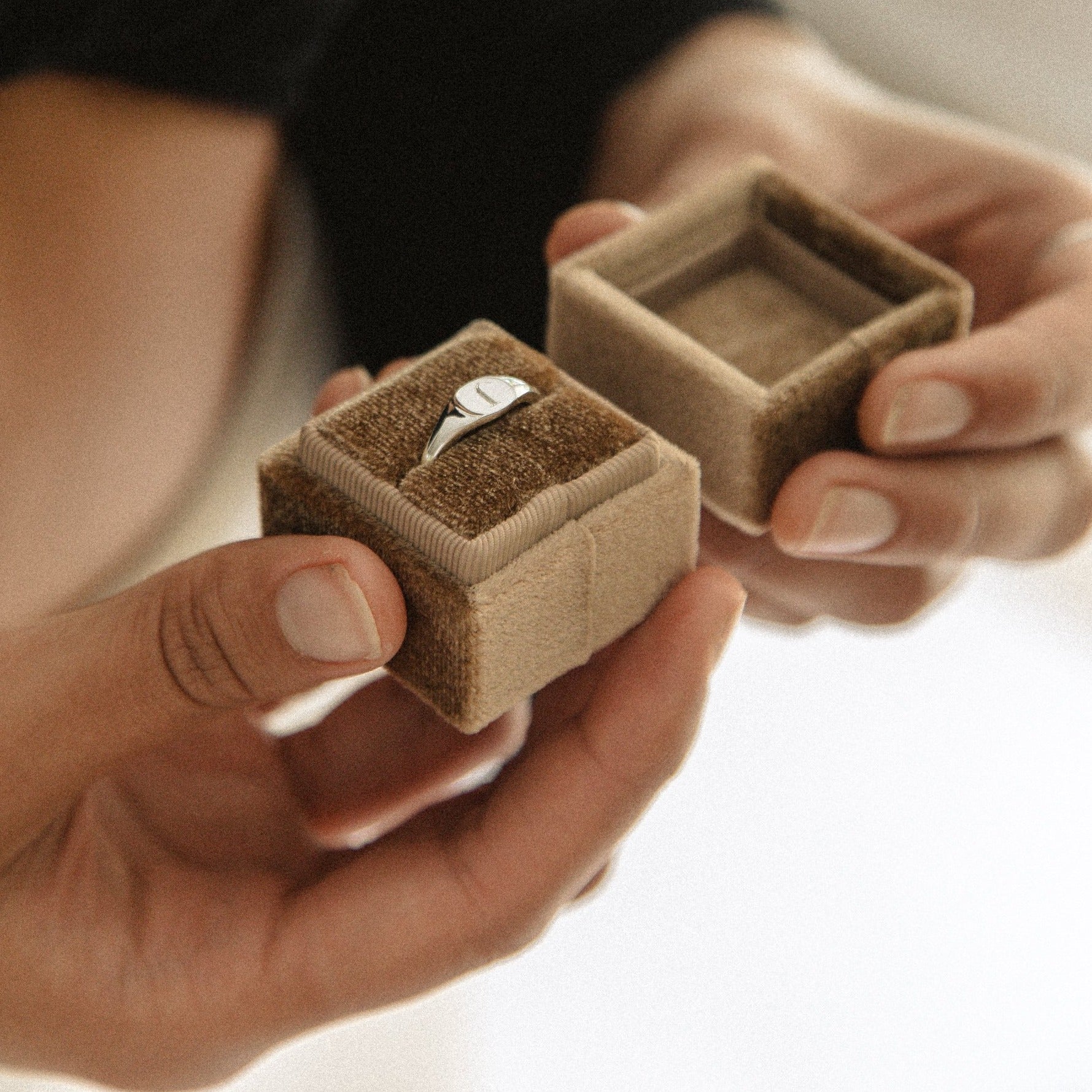 A Signet Ring with personalised engraving sits inside a beautiful velvet ring gift box. 