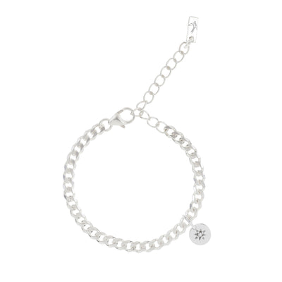 A sterling silver cuban link braceket chain with an adjustable extension chain.  A Vintage Pearl pendant sits on the chain and features a seed pearl set in a vintage inspired star.